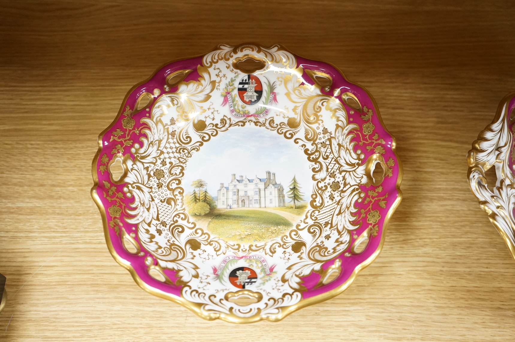 Four G Grainger, Worcester armorial porcelain comports, c.1845, hand painted with named views of Worcester, 24cm in diameter